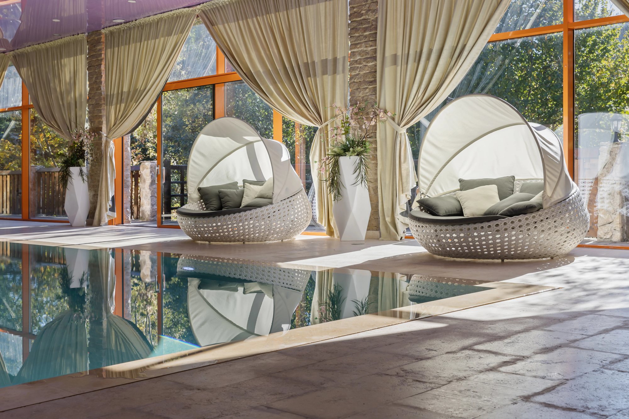 Pool & Spa — Spa day beds by the pool