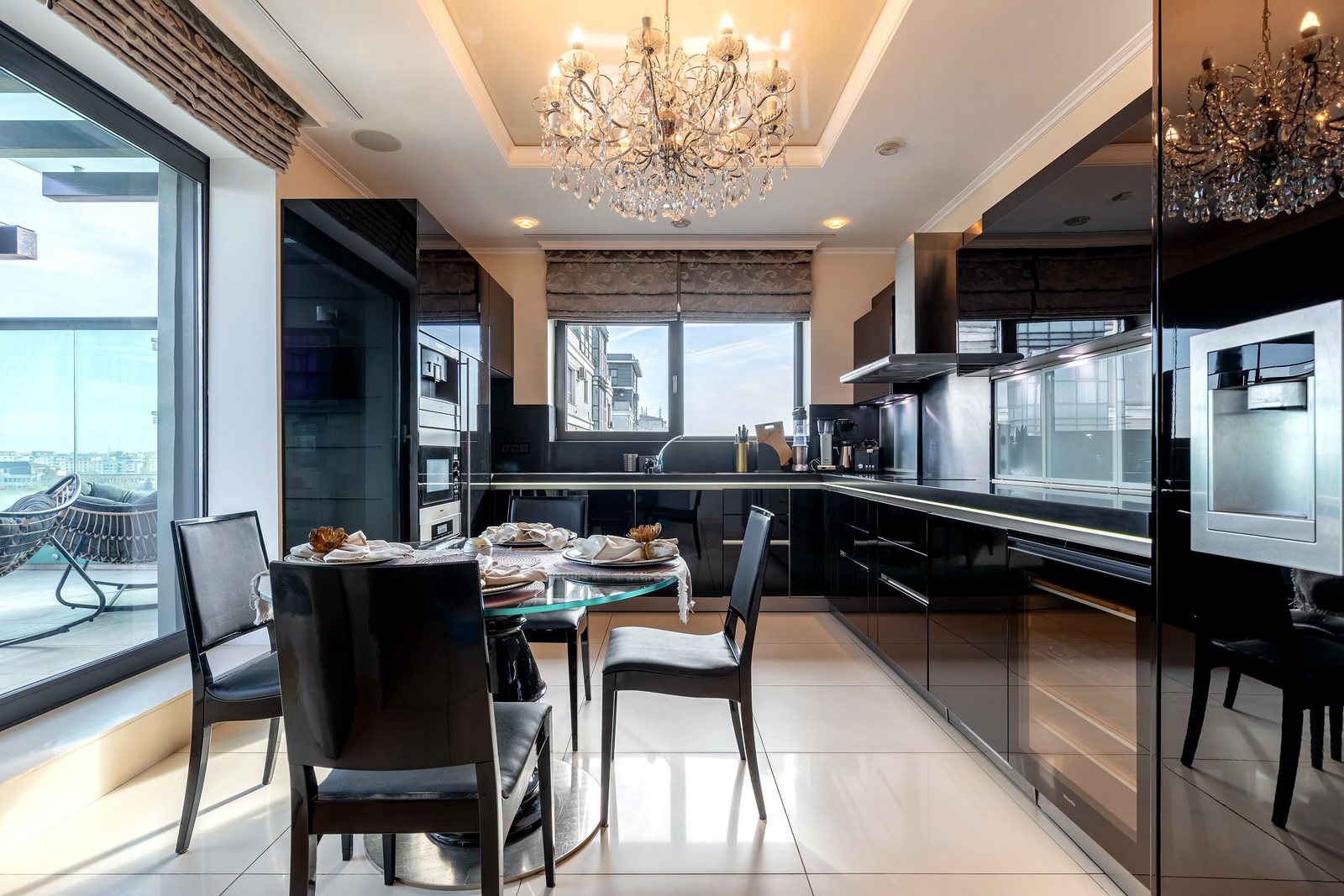 The kitchen in black gloss and marble