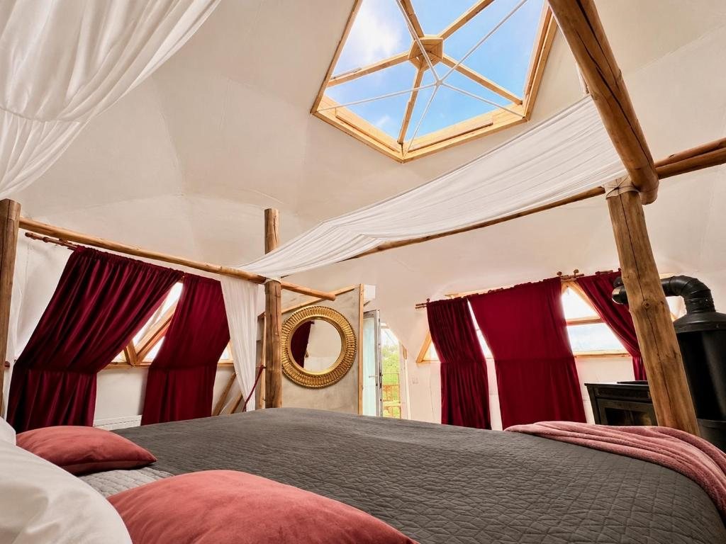A fireplace and a bed for two